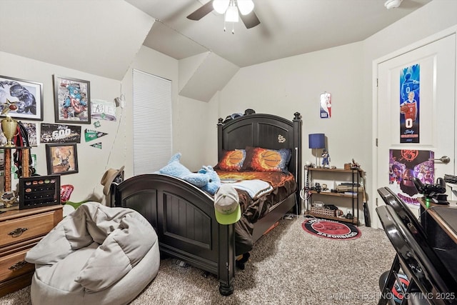 carpeted bedroom with ceiling fan and lofted ceiling
