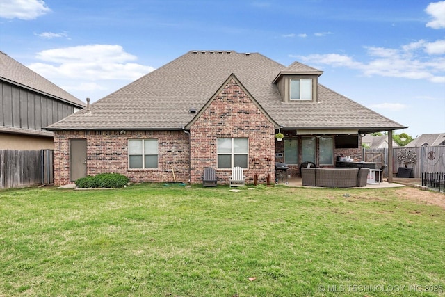 back of property featuring a patio, brick siding, an outdoor living space, and a fenced backyard