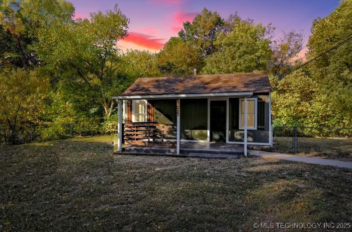 902 N Industrial Ave, Sand Springs, OK 74063 - exterior space featuring a lawn and fence