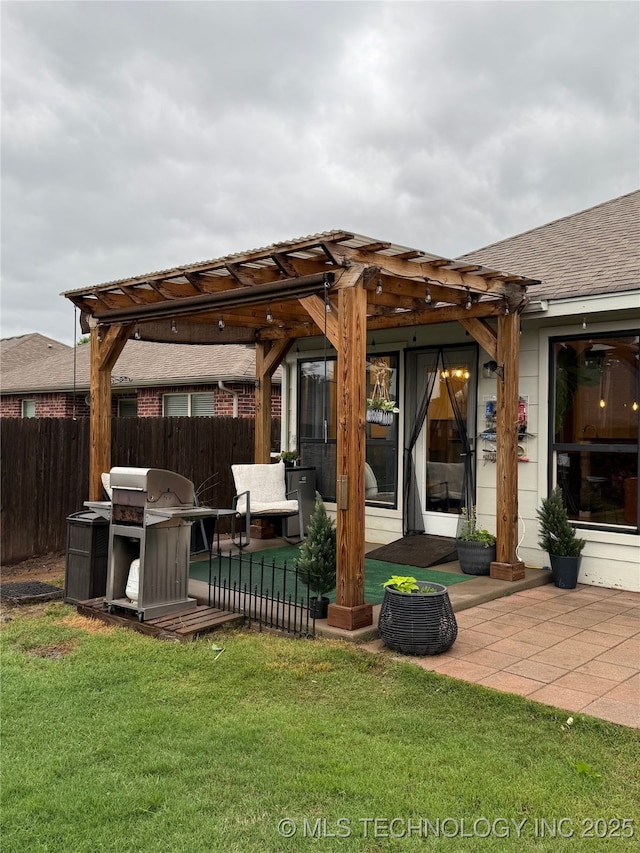 view of patio with fence, a pergola, and area for grilling