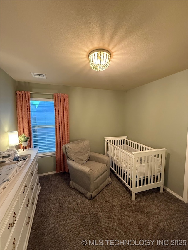 bedroom with visible vents, baseboards, and dark colored carpet