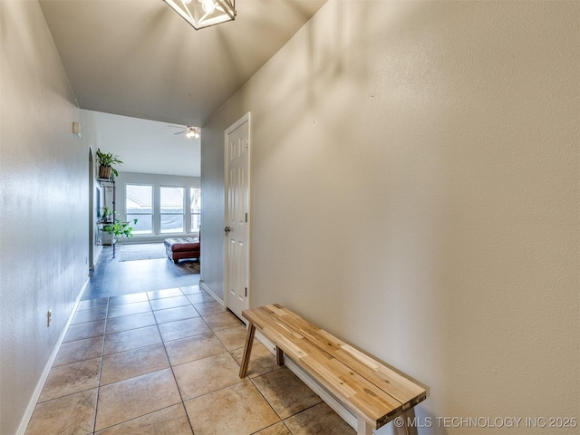 4312 N 33rd St, Broken Arrow, OK 74014 - hallway with light tile patterned floors and baseboards