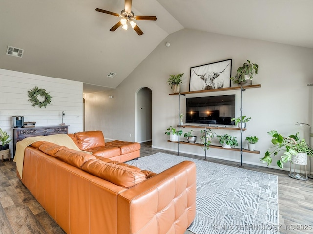 4312 N 33rd St, Broken Arrow, OK 74014 - living area featuring arched walkways, ceiling fan, visible vents, and wood finished floors