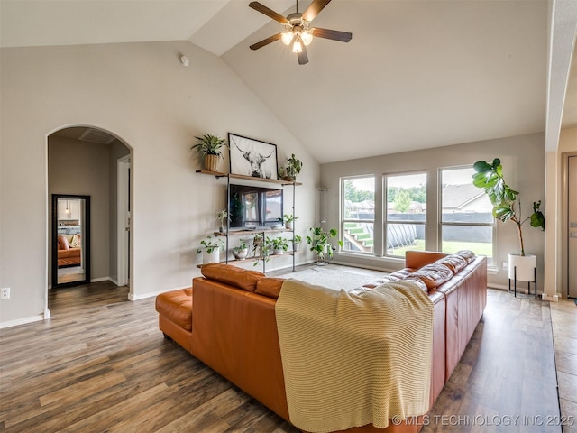 4312 N 33rd St, Broken Arrow, OK 74014 - living area featuring arched walkways, a ceiling fan, high vaulted ceiling, and wood finished floors