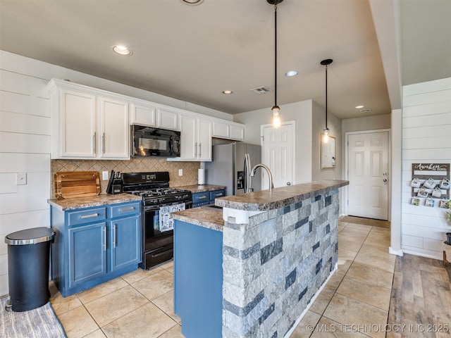 4312 N 33rd St, Broken Arrow, OK 74014 - kitchen with decorative backsplash, white cabinetry, black appliances, and blue cabinetry