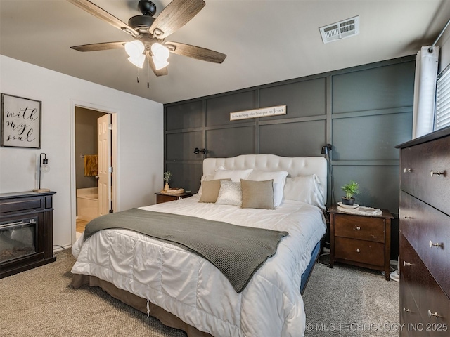 4312 N 33rd St, Broken Arrow, OK 74014 - bedroom with ensuite bath, carpet floors, a decorative wall, a ceiling fan, and visible vents