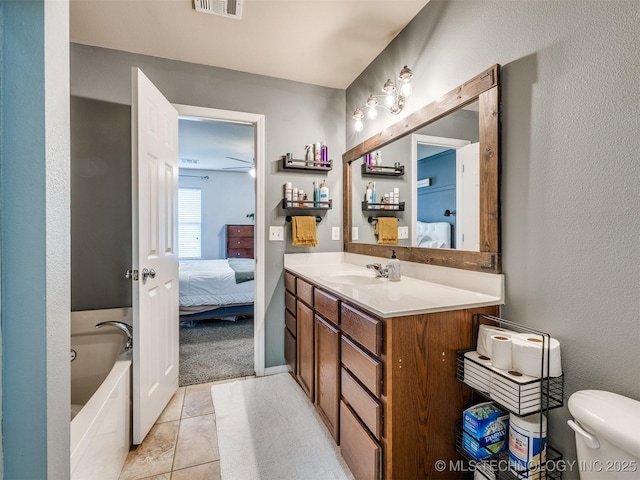 4312 N 33rd St, Broken Arrow, OK 74014 - bathroom with tile patterned flooring, vanity, a bathing tub, toilet, and ensuite bathroom