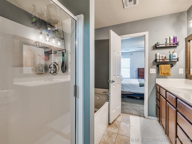 4312 N 33rd St, Broken Arrow, OK 74014 - full bathroom featuring visible vents, tile patterned flooring, vanity, connected bathroom, and a shower stall