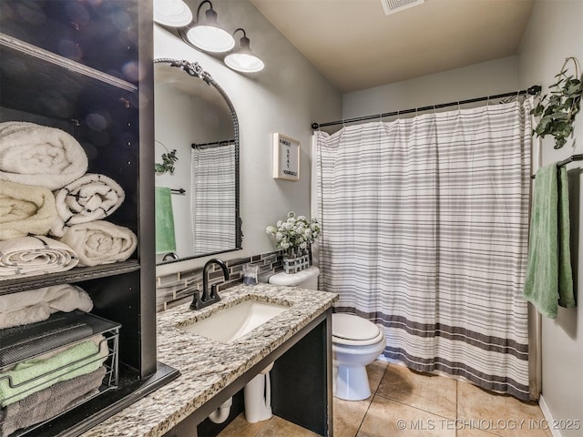 4312 N 33rd St, Broken Arrow, OK 74014 - bathroom with visible vents, curtained shower, a sink, tile patterned floors, and toilet