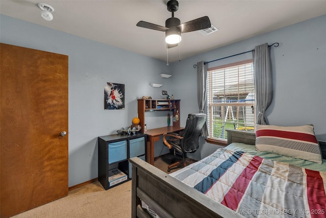 bedroom featuring baseboards, visible vents, ceiling fan, and light colored carpet