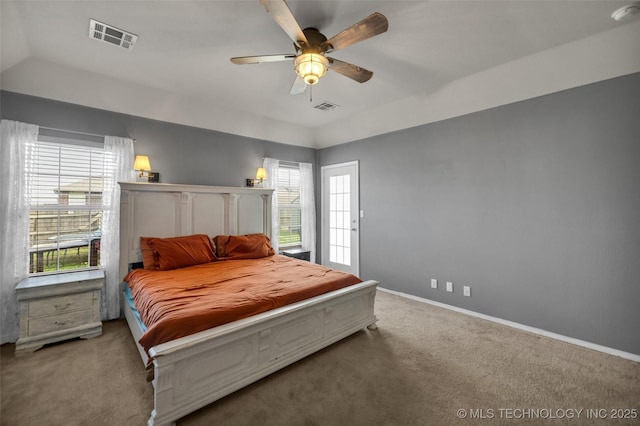carpeted bedroom featuring visible vents, baseboards, and ceiling fan