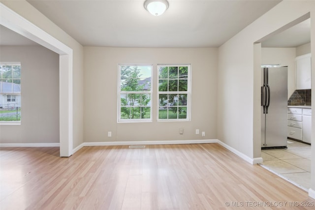 5137 W 6th St, Tulsa, OK 74127 - empty room with light wood-type flooring and baseboards
