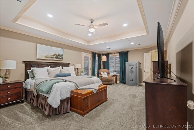 carpeted bedroom featuring a raised ceiling, ornamental molding, and recessed lighting