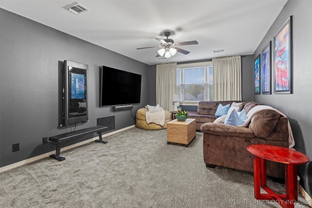 carpeted living room featuring baseboards, a ceiling fan, and visible vents