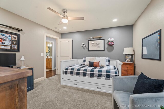 bedroom featuring light colored carpet, recessed lighting, baseboards, and a ceiling fan