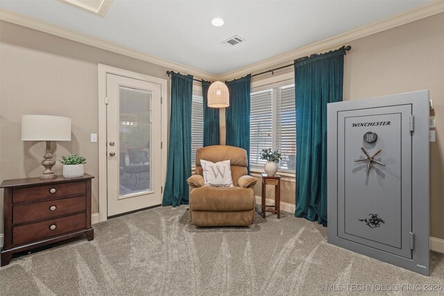 sitting room featuring crown molding, visible vents, and carpet