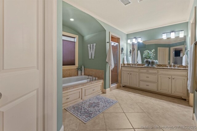 full bathroom featuring double vanity, a garden tub, visible vents, a shower stall, and tile patterned floors