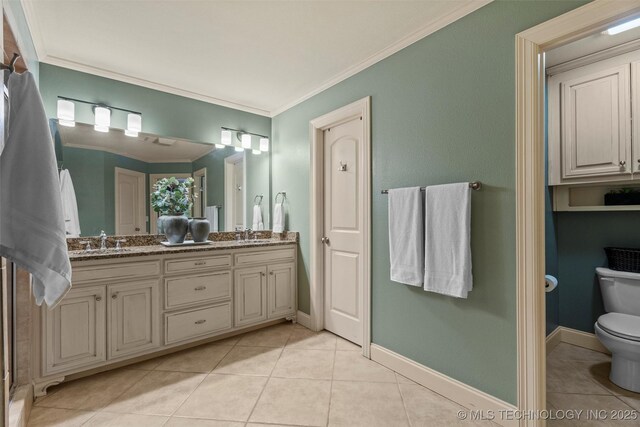 full bathroom with a sink, tile patterned flooring, double vanity, toilet, and ornamental molding