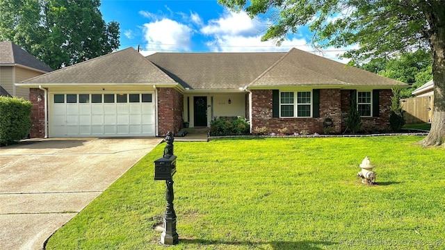 ranch-style home featuring roof with shingles, brick siding, a garage, a front yard, and concrete driveway