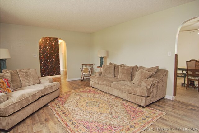 74703 S 320th Rd, Wagoner, OK 74467 - living area with arched walkways and wood finished floors