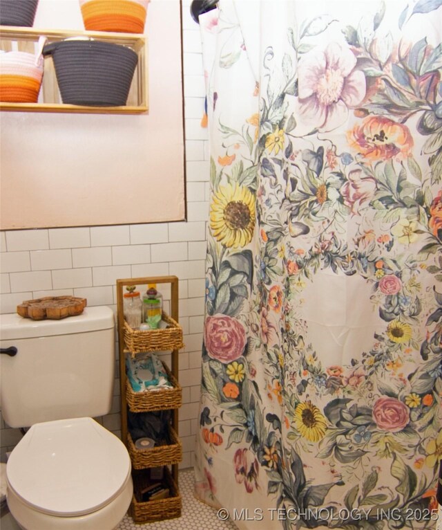 74703 S 320th Rd, Wagoner, OK 74467 - full bath with tile walls, tile patterned floors, a shower with curtain, and toilet
