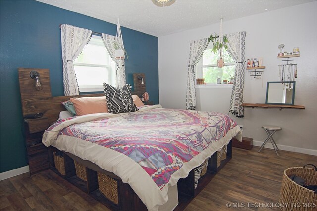 74703 S 320th Rd, Wagoner, OK 74467 - bedroom with baseboards, multiple windows, and wood finished floors