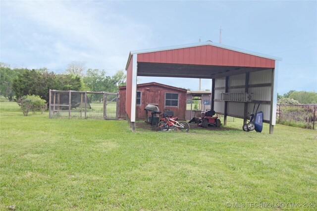 74703 S 320th Rd, Wagoner, OK 74467 - view of pole building featuring a lawn and a detached carport