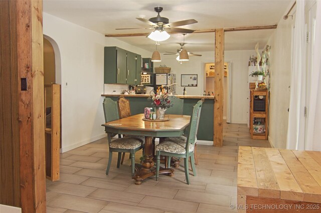 74703 S 320th Rd, Wagoner, OK 74467 - dining space with arched walkways and a ceiling fan