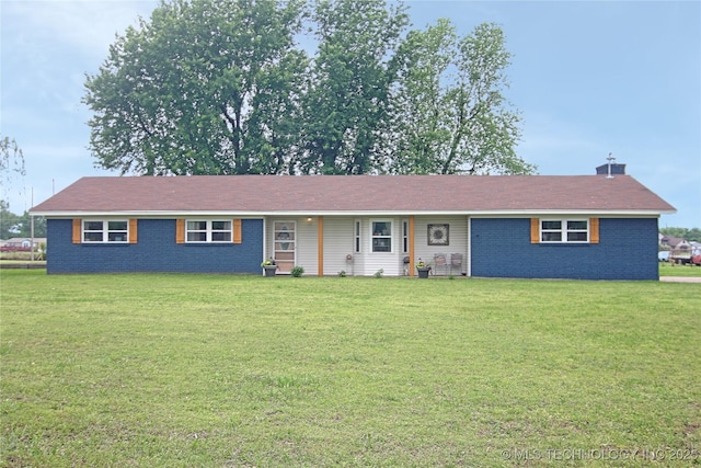 single story home featuring a front lawn and brick siding