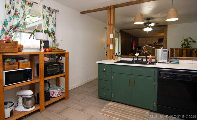 74703 S 320th Rd, Wagoner, OK 74467 - kitchen featuring black dishwasher, light countertops, a sink, and green cabinets