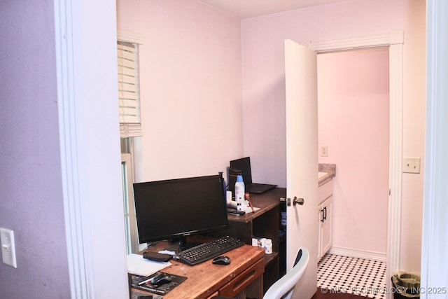 office space featuring baseboards
