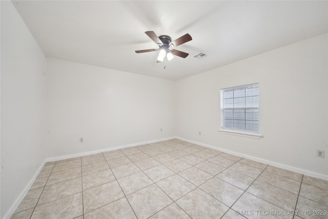unfurnished room featuring a ceiling fan, visible vents, and light tile patterned flooring