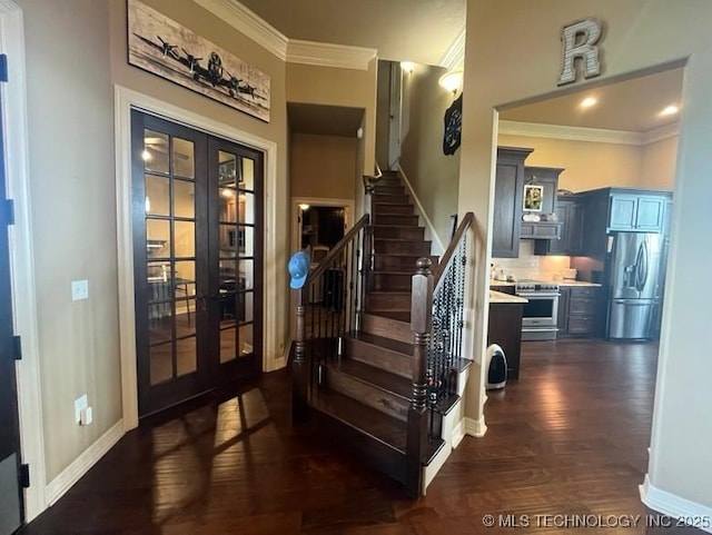 staircase with crown molding, baseboards, french doors, and wood finished floors