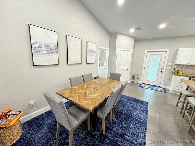 dining room with recessed lighting, baseboards, visible vents, and finished concrete flooring