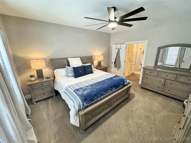 bedroom featuring baseboards, carpet, a ceiling fan, and connected bathroom