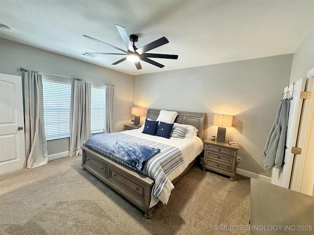 bedroom featuring carpet floors, a ceiling fan, baseboards, and visible vents