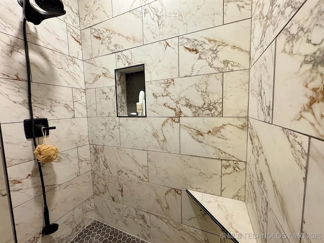 bathroom featuring a tile shower