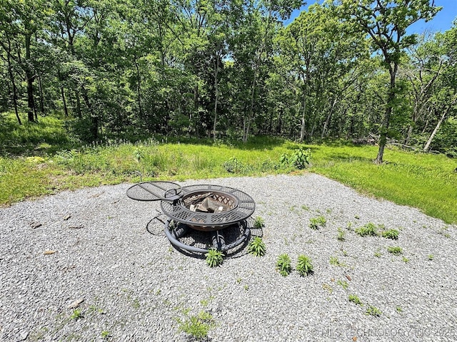view of patio / terrace with an outdoor fire pit