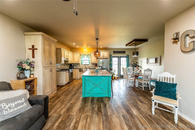 kitchen with stainless steel appliances, a center island, hanging light fixtures, and dark wood-type flooring