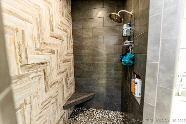 full bathroom with tiled shower