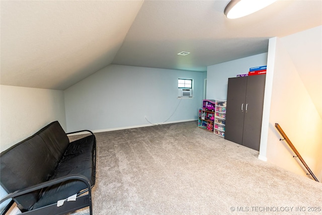 living area featuring carpet floors, visible vents, lofted ceiling, cooling unit, and an upstairs landing