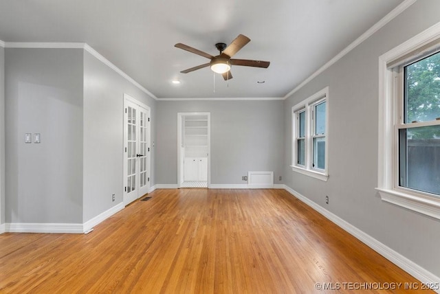 unfurnished room with a ceiling fan, baseboards, french doors, and light wood finished floors