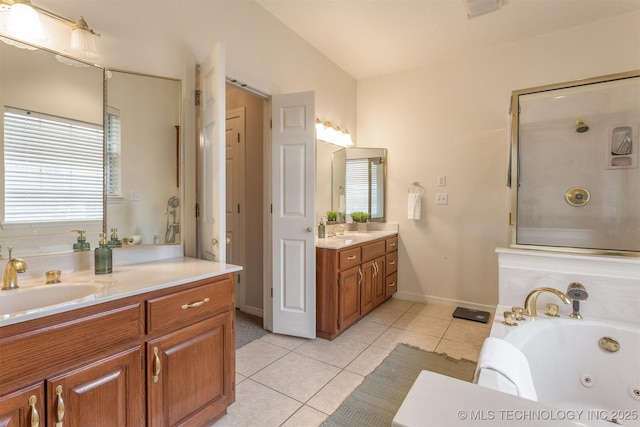 13303 E 95th Pl N, Owasso, OK 74055 - full bath with two vanities, tile patterned floors, a tub with jets, and a sink