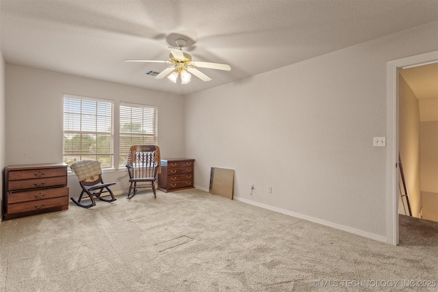 13303 E 95th Pl N, Owasso, OK 74055 - living area with visible vents, carpet flooring, baseboards, and a ceiling fan
