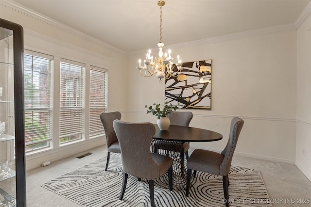 13303 E 95th Pl N, Owasso, OK 74055 - carpeted dining room with an inviting chandelier, baseboards, ornamental molding, and visible vents