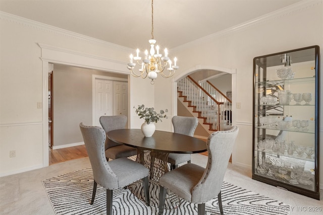 13303 E 95th Pl N, Owasso, OK 74055 - dining area with an inviting chandelier, ornamental molding, stairs, light carpet, and arched walkways
