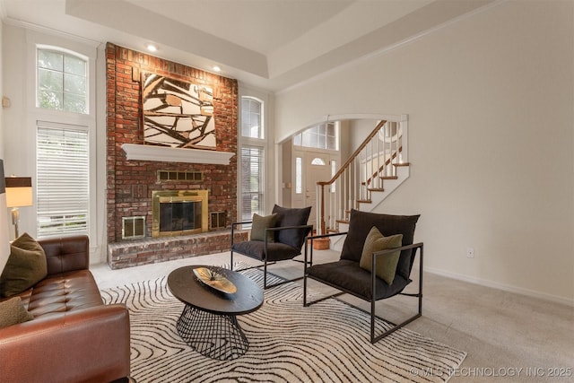 13303 E 95th Pl N, Owasso, OK 74055 - carpeted living area featuring plenty of natural light, arched walkways, and a towering ceiling