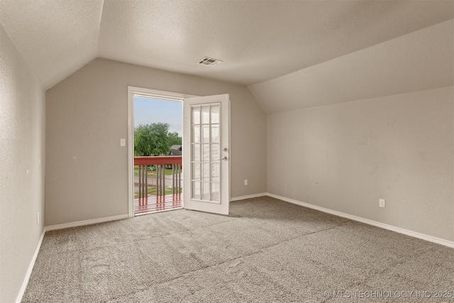 13303 E 95th Pl N, Owasso, OK 74055 - additional living space featuring visible vents, baseboards, carpet floors, and vaulted ceiling