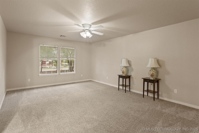 13303 E 95th Pl N, Owasso, OK 74055 - unfurnished room featuring carpet floors, a textured ceiling, ceiling fan, and baseboards
