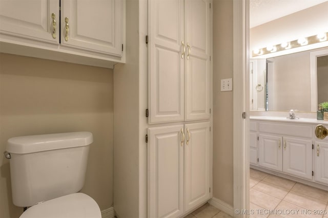 13303 E 95th Pl N, Owasso, OK 74055 - bathroom featuring vanity, baseboards, tile patterned floors, and toilet